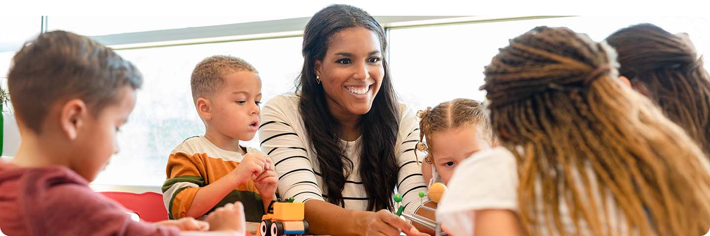 Woman teaching students in a classroom.