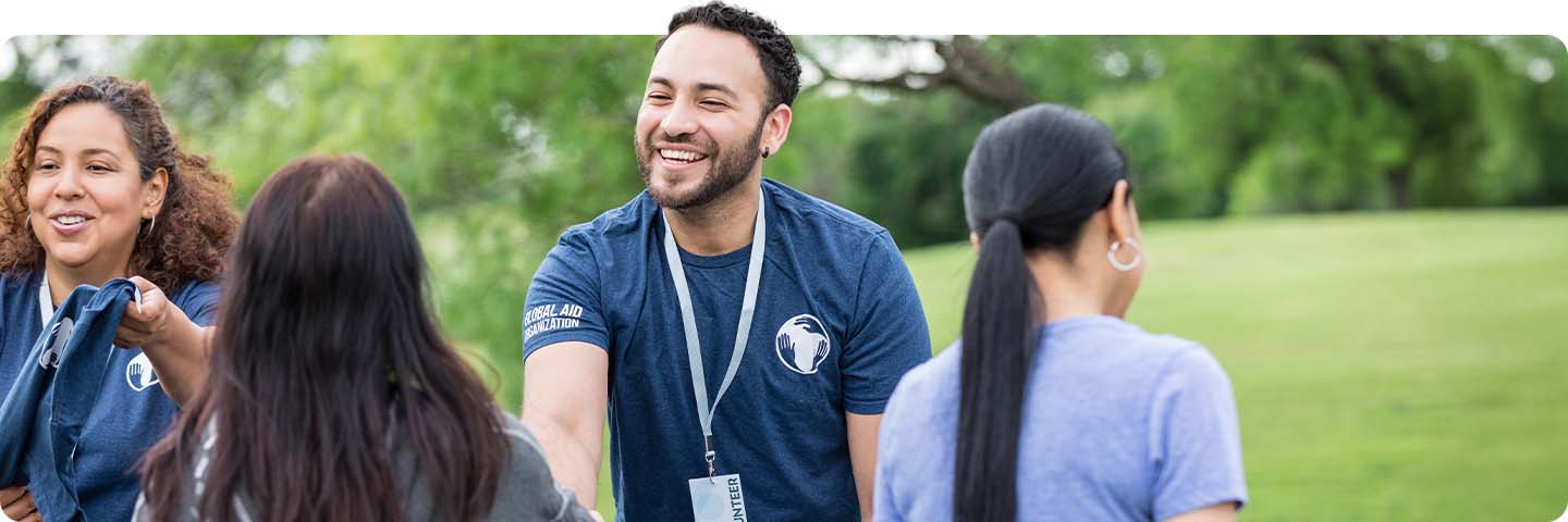 Volunteer coordinator smiling at event.
