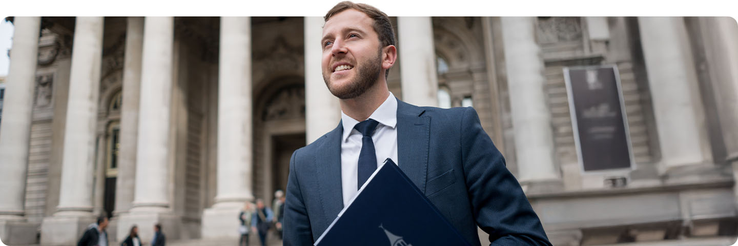 Lawyer outside of historical building.