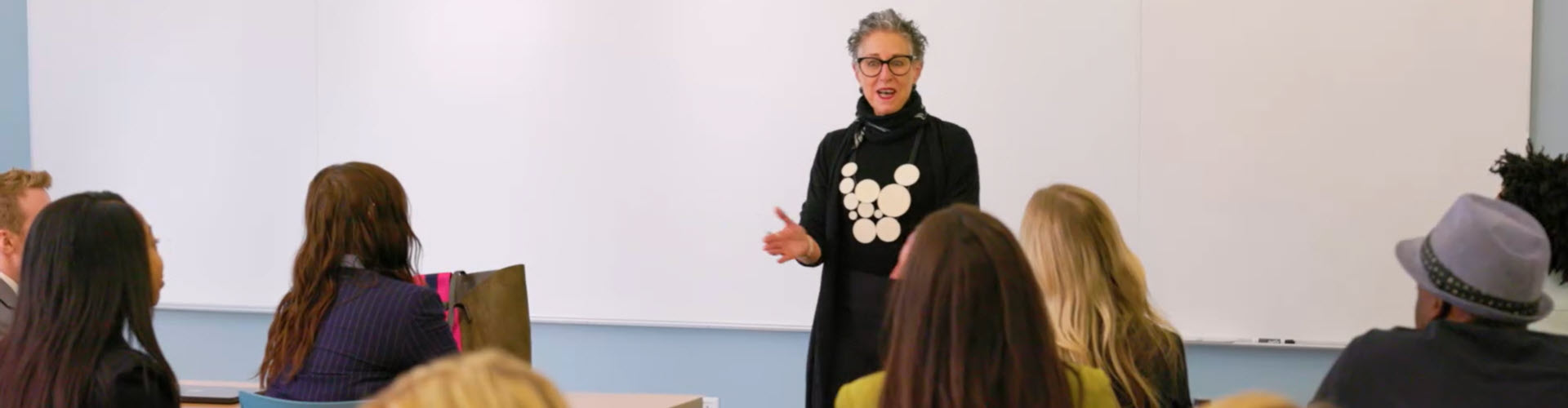 female teacher at the front of the classroom