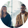 white female and black male sitting next to each other infront of windows